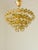 An exceptional and wonderfully decorative vintage chandelier featuring 58 genuine Murano glass fruit crystals arranged...