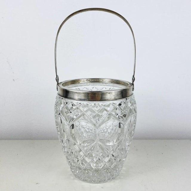 Elevate your entertaining with this vintage Italian crystal and 800 silver ice bucket. Crafted with timeless elegance,...
