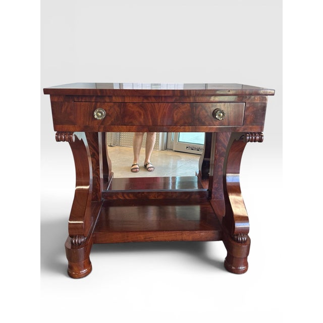 Antique French Empire Style Flame Mahogany Console Table with Mirror. Remarkable and elegant single drawer rolling console...