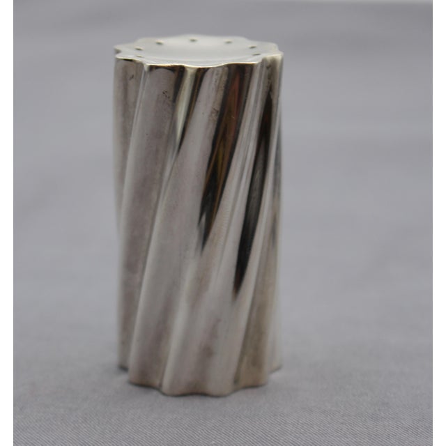 Pair of Towle sterling silver salt & pepper shakers. Pattern 10801. Striking twisted bodies, the "swirl" pattern. 1.70...
