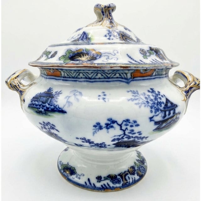 English Ironstone by Charles Meigh Soup Tureen and Stand Circa 1820 lots of colors dominated by blue, gold, and white.
