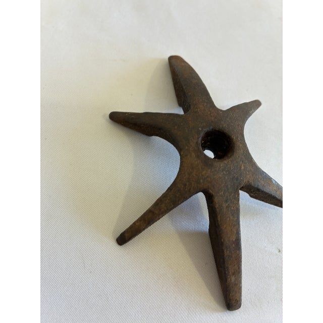 Vintage cast iron star wheel from an old piece of farm or industrial equipment. This six-point wheel has a wonderful aged...