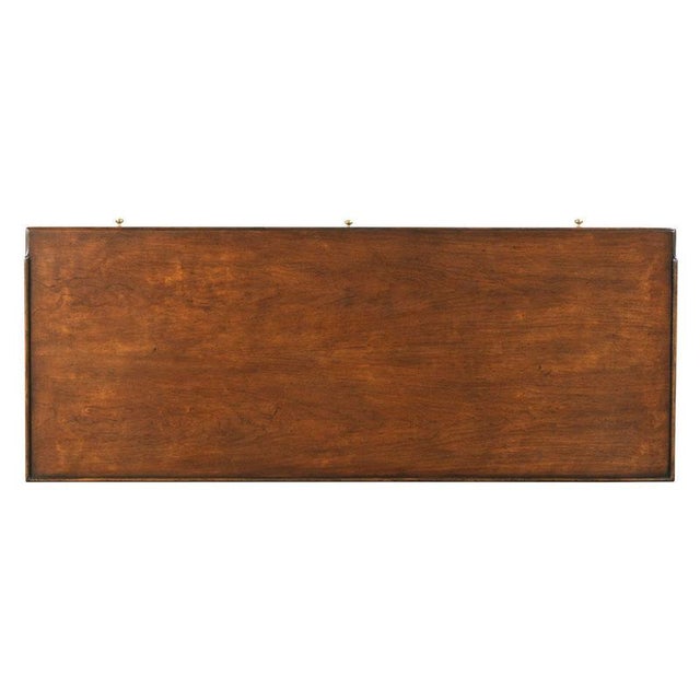 A galleried rectangular cherry top rests over an apron rail drawer and two deep drawers for storage or filing, elevated by...