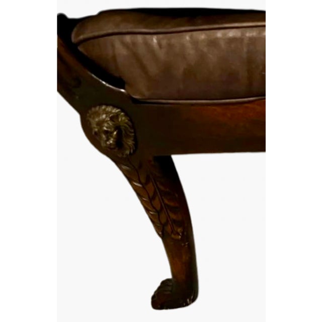 This Regency‑style armchair, crafted with a mahogany frame and cane panels, reflects the refined aesthetic of early...