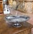 This elegant antique bread basket was crafted in France circa 1880. Made of silver-plated metal, the oval form is raised...