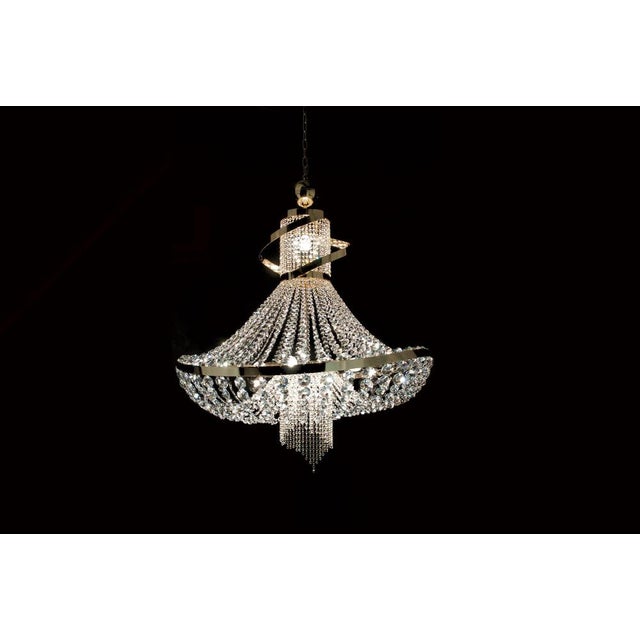 Dancer 6 lights cascading chandelier in polished chrome and glass by aggiolight. Dimensions: d 80 x h 96 cm. Materials:...