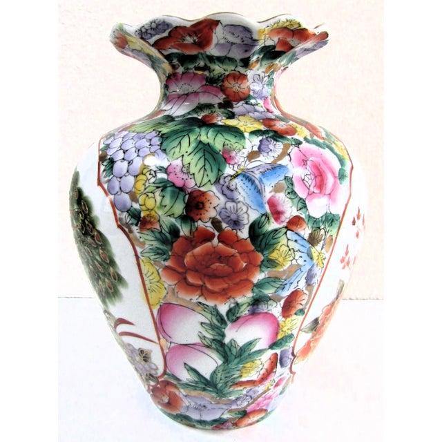 Vintage Chinoiserie Hand Painted Famille Rose Peacock Porcelain Vase Floral design with peacock scenes. Ruffled neck....