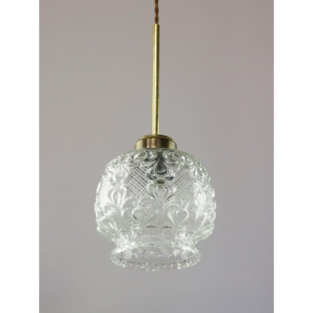 Lamp's cover is made of genuine brass material complementing this vintage item nicely with it's golden colour. total...