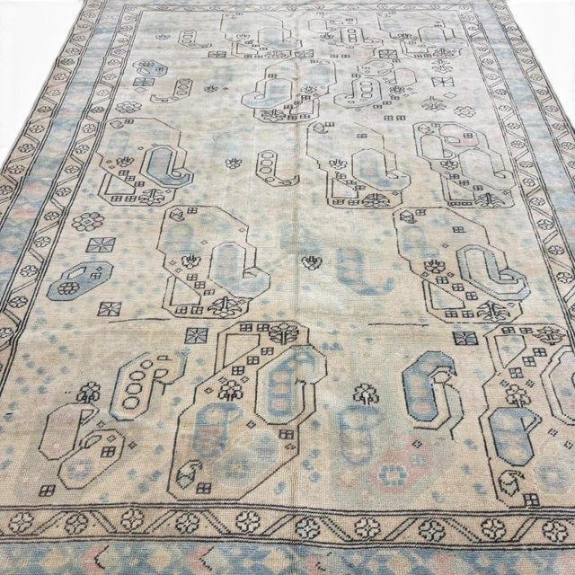 This antique Turkish rug stands out for its distinctive interpretation of the traditional boteh motif. Stylized boteh...