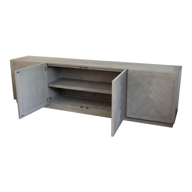 This Restoration Hardware Grey Herringbone 4-Door Media Console offers a refined balance of modern simplicity and classic...
