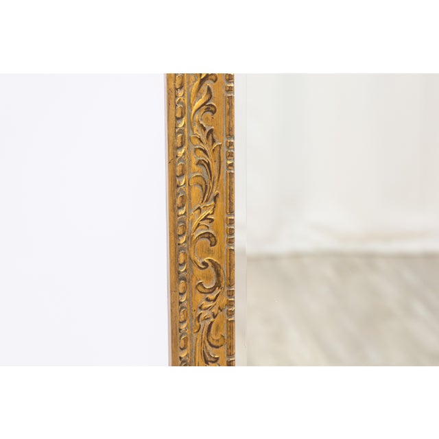 A vintage mid-century modern Italian gilded frame mirror. This is a gorgeous vintage hand made mirror featuring ornate...