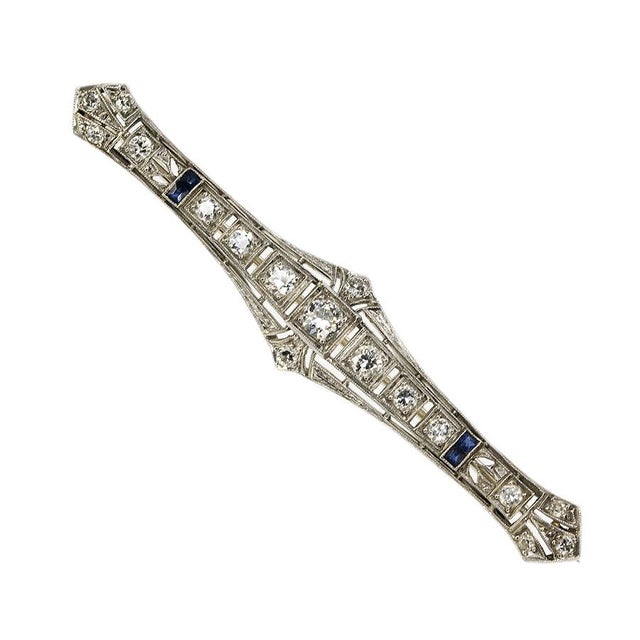 Platinum Art Deco Bar Brooch set with17 Old European cut diamonds weighing approximately 2.00 carats and sapphires 5.80 grams