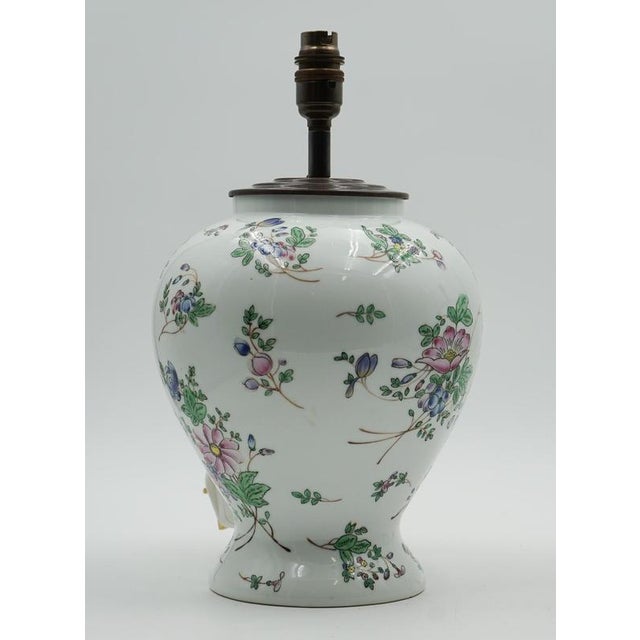 A beautiful pair of 1960s Chinese Qianlong Nian Zhi porcelain vases, expertly converted into striking table lamps. Each...