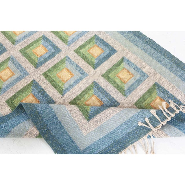 Vintage Swedish Flat Woven Rug by Alice Walleback Size: 4'7" × 6'7" (139 × 200 cm) This vintage Swedish flat-woven rug by...