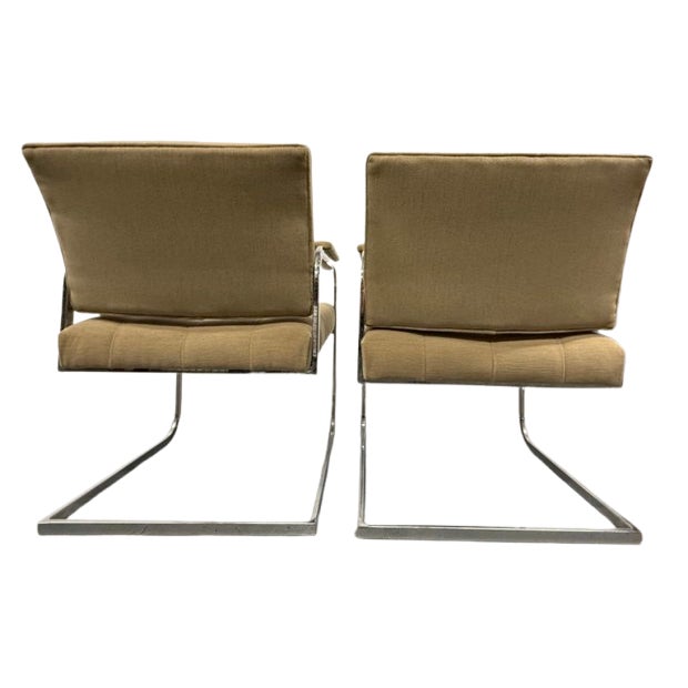 Pair of steel-framed Bauhaus chairs reupholstered in beige limousine fabric.