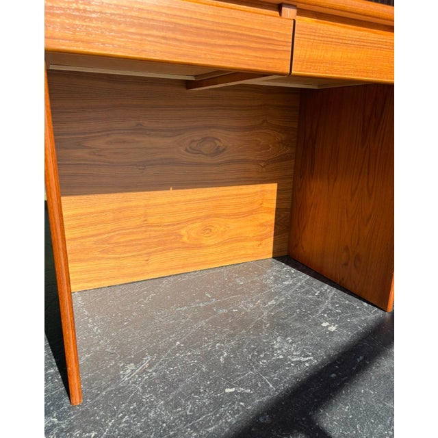 Classic, timeless design in Danish teak furniture. Simple and refined, this desk or vanity is a great, petite size. Larger...