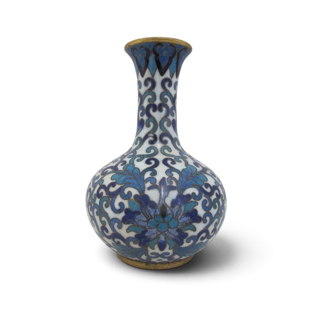 Small Chinese Cloisonne vase. Brass with white enamel background showing vibrant cobalt blue and turquoise flowers and a...
