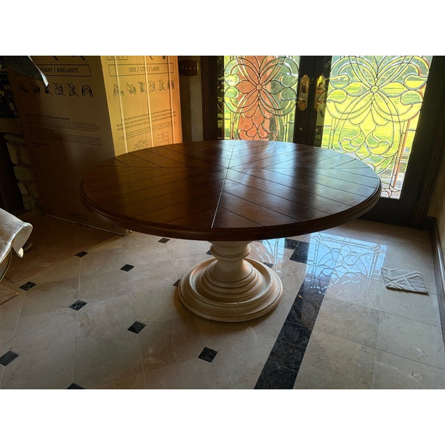 This Town and Country Centre Table has a top design that combines planked boards in a reverse diamond pattern. An...