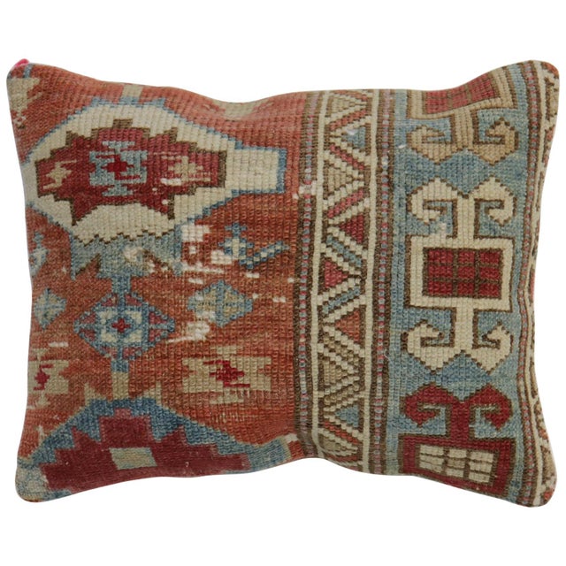 Pillow made from an early 20th century Caucasus rug in a soft warm palette in rustic colors. zipper closure and poly-fill...