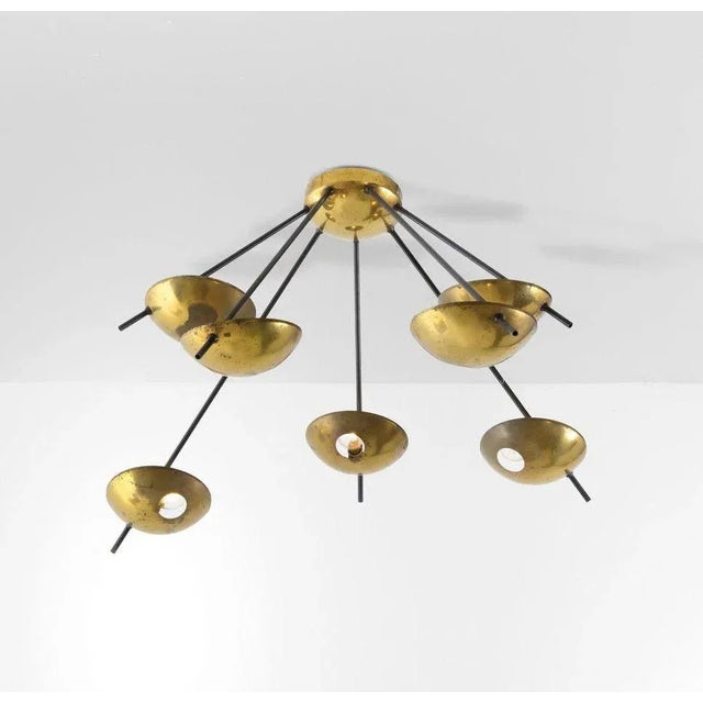 Vintage light fixture (can be mounted both in ceiling or wall stance) made of polished brass, seven sockets and seven...