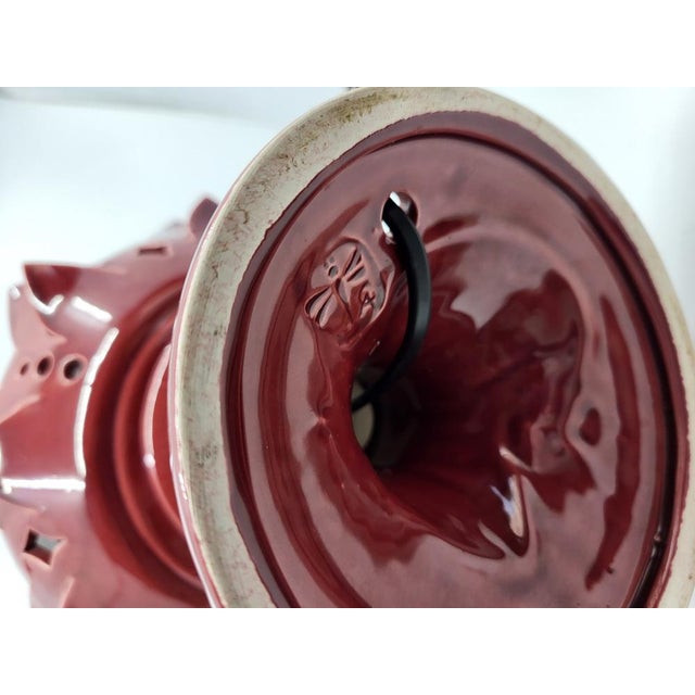 Add a touch of artistic and functional elegance to your home with this stunning Bordeaux ceramic lamp. Inspired by the...