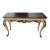 This appears to be an elegant French Provincial/Louis XV-style console table or writing desk with a black marble top,...