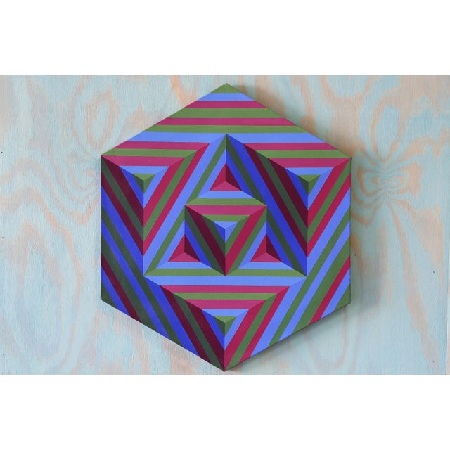A one of a kind geometric op art painting featuring nested triangles within a hexagon. Bold blue, green, and red stripes...