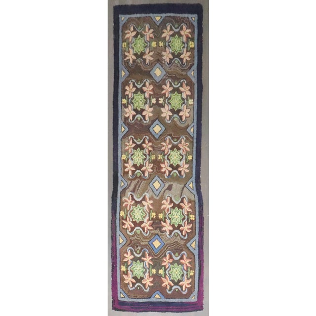 a floral motif mid-20th century American Hooked Runner Details rug no. j4055 size 3' 3" x 10' 7" (99 x 323 cm)