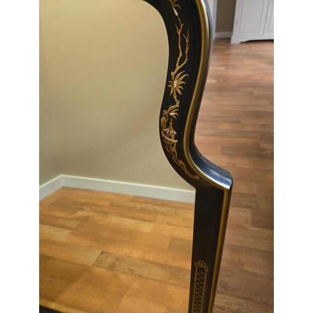 Vintage black lacquer chinoiserie wall mirror. Hand-painted, elegant chinoiserie-style mirror with gold gilt detail...