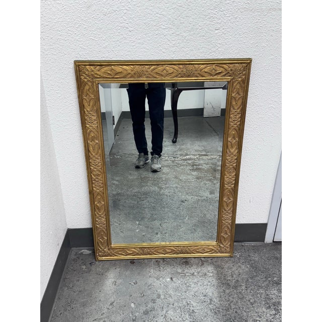 Design Plus Gallery presents an Art Deco Wall Mirror from Decorative Arts, Inc. It has a thick gold frame holding a...