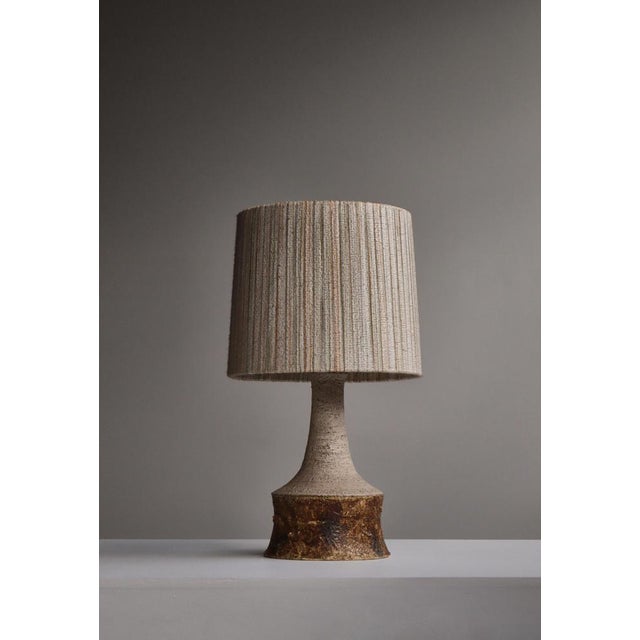 Danish Modern stoneware table lamp by Bartholdy, Denmark, 1970s. Featuring a richly textured ceramic body with earthy...
