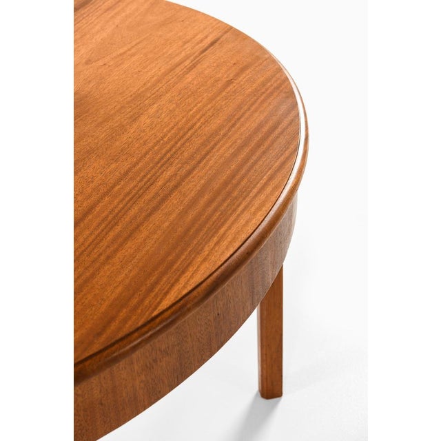 This rare dining table, designed by Kaare Klint and produced by the esteemed cabinetmaker Rud. Rasmussen in Denmark during...