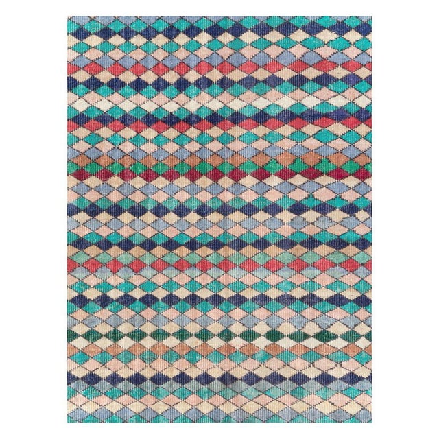 A whimsical vintage Turkish Anatolian 6' x 9' accent rug handmade during the mid-20th century with a colorful and...