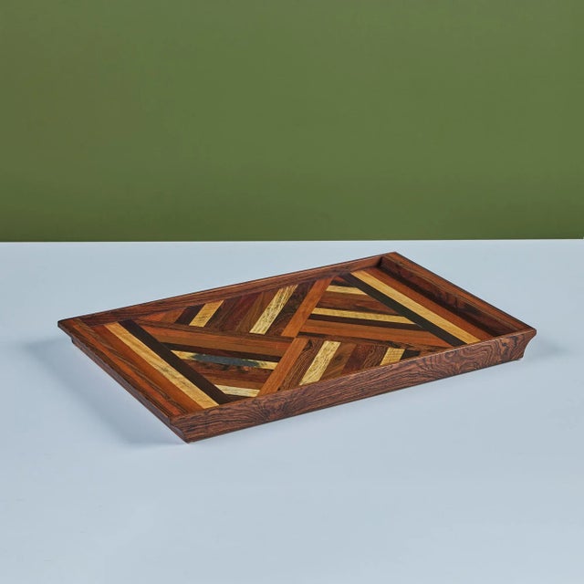 A rosewood serving tray by Don Shoemaker for his company Señal in the 1960s. The surface of the tray has a repeating...
