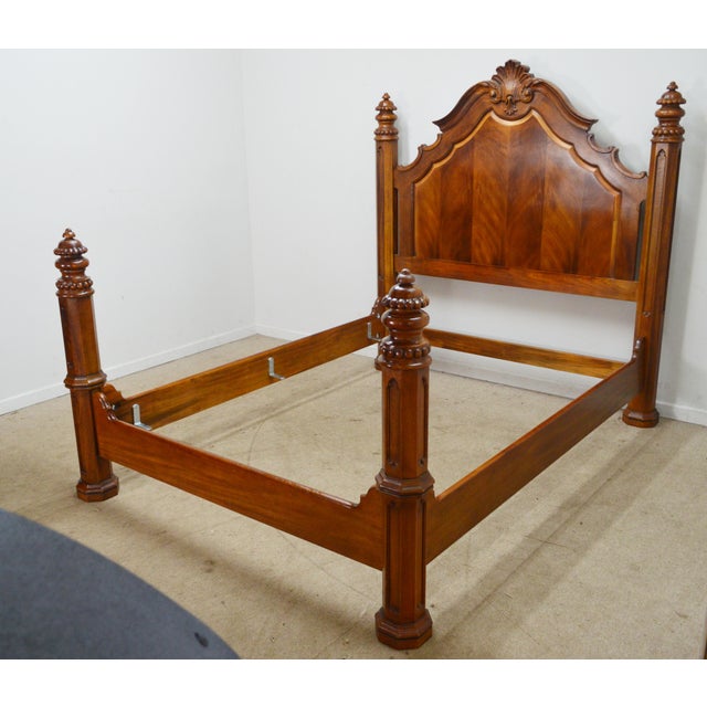 Queen Bed by Henredon. Store item #545. It features carved wood and solid wood construction.