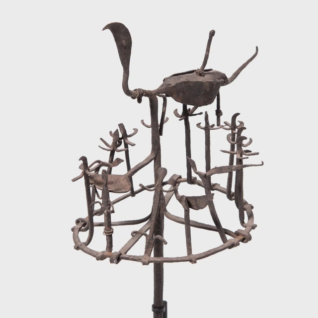 To cure mental and physical ailments, Yoruba priests and diviners invoke the aid of Osanyin, the god of herbal medicines....