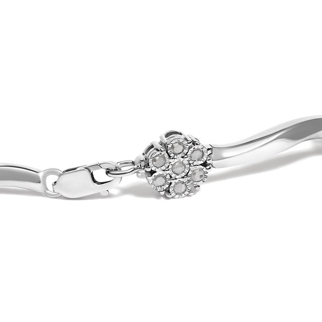 Elegant and timeless, this gorgeous sterling silver floral link bracelet features 1.0 carat total weight of round cut...
