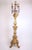 A fine Italian early 18th century giltwood torchère on triform base carved on the front side, with seven scrolled gilt-...