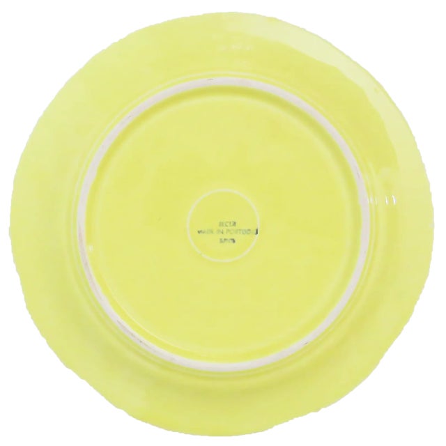 A lovely pair of yellow cabbage ware plates from the esteemed Portuguese pottery fabricator, SECLA.. En verso, one has the...