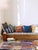 Modern Boujad Rug | Handwoven Wool Rug in Lavender with Orange & Cobalt Flame Motifs This dynamic modern Boujad rug rises...