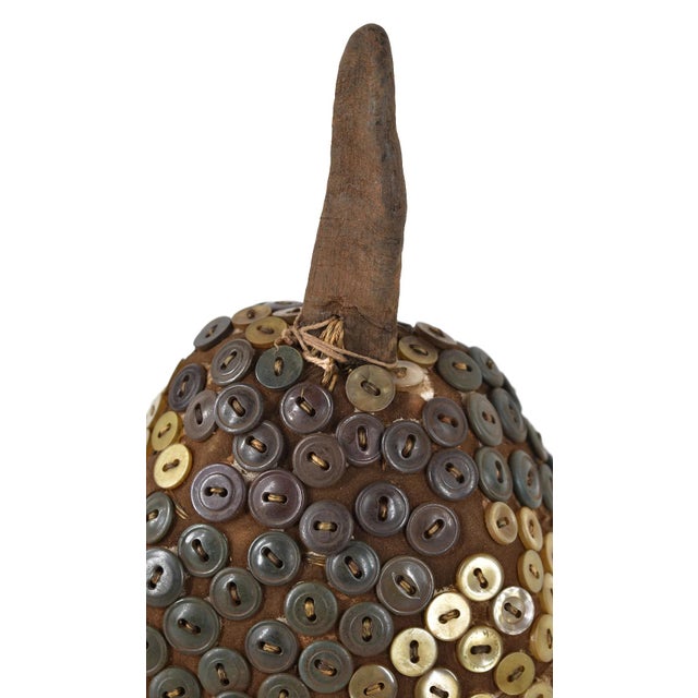 The Lega Bwami Society hat was crafted in the eastern regions of the Democratic Republic of Congo. This woven, palm fiber...