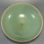 This antique Chinese Longquan celadon bowl is decorated with carved lotus petal patterns on the exterior. It features...