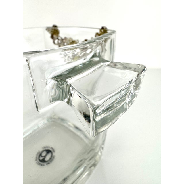 Square-form glass ice bucket by Arthur Court Designs, accented with cast metal vine and grape overlays in a silver-tone...