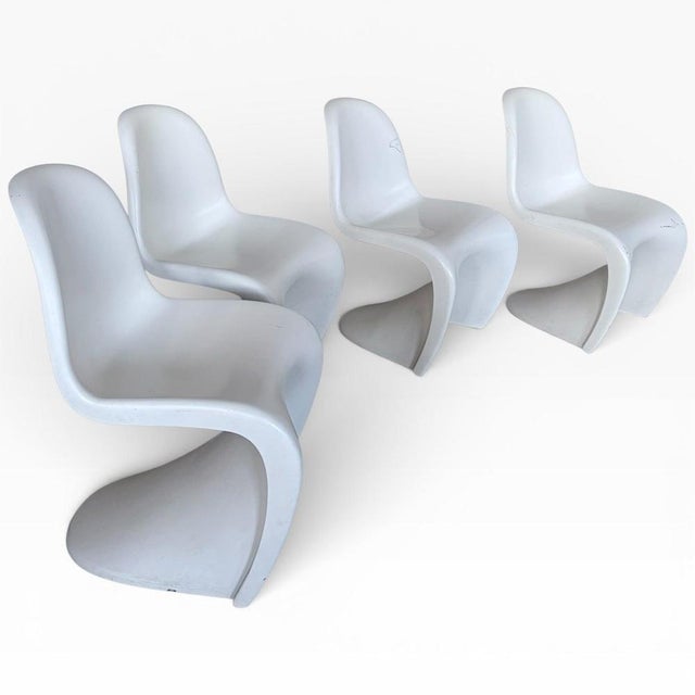 An iconic set of four original Verner Panton cantilever chairs — one of the most recognisable Space Age designs of the...