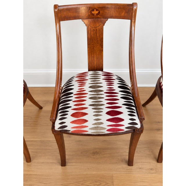 Set of 6 Neoclassical Regency Style Dining Chairs - 4 side chairs & 2 arm chairs. Freshly reupholstered in an abstract...