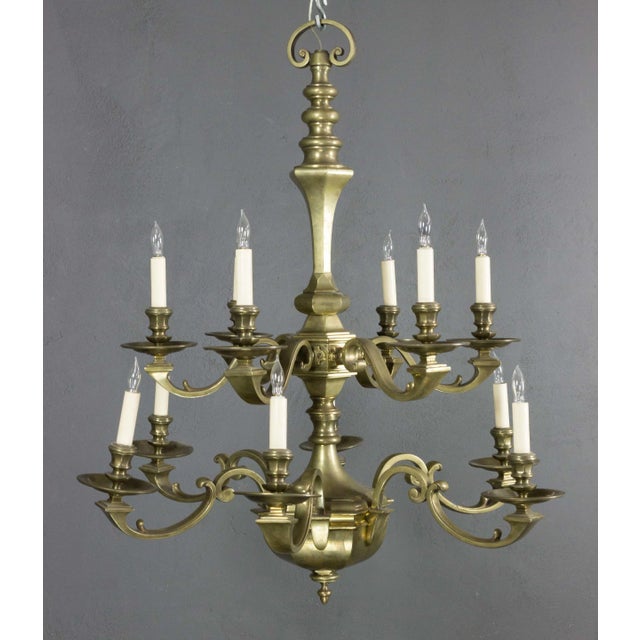 This stunning French chandelier from the 1940s is a captivating blend of bronze and metal. Designed in a neoclassical...