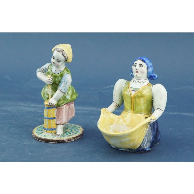 Measurements: standing woman: height: 11 cm; width: 6.5 cm; depth: 6.5 cm seated woman: height: 9.7 cm; width: 7 cm;...