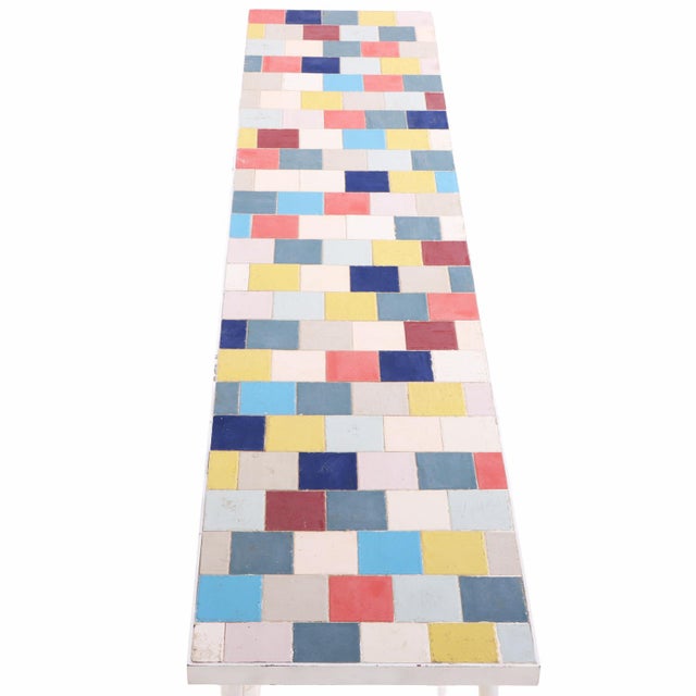 Colorful and distinctive Bohemian Modern sofa or media table featuring a long, narrow rectangular top inset with an array...