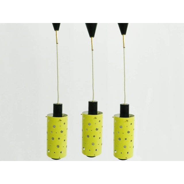 French Brass and Yellow Perforated Metal Pendant Lamps by Mathieu Mategot, 1950s, Set of 3 For Sale - Image 6 of 6
