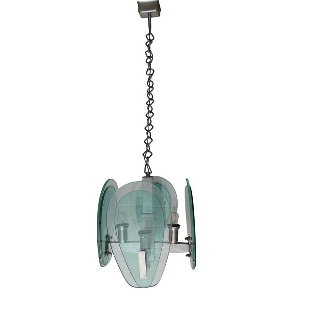 This lovely glass and chone lamp was made by Fontana Arte, a name synonymous with luxury Italian lighting. There are 8...